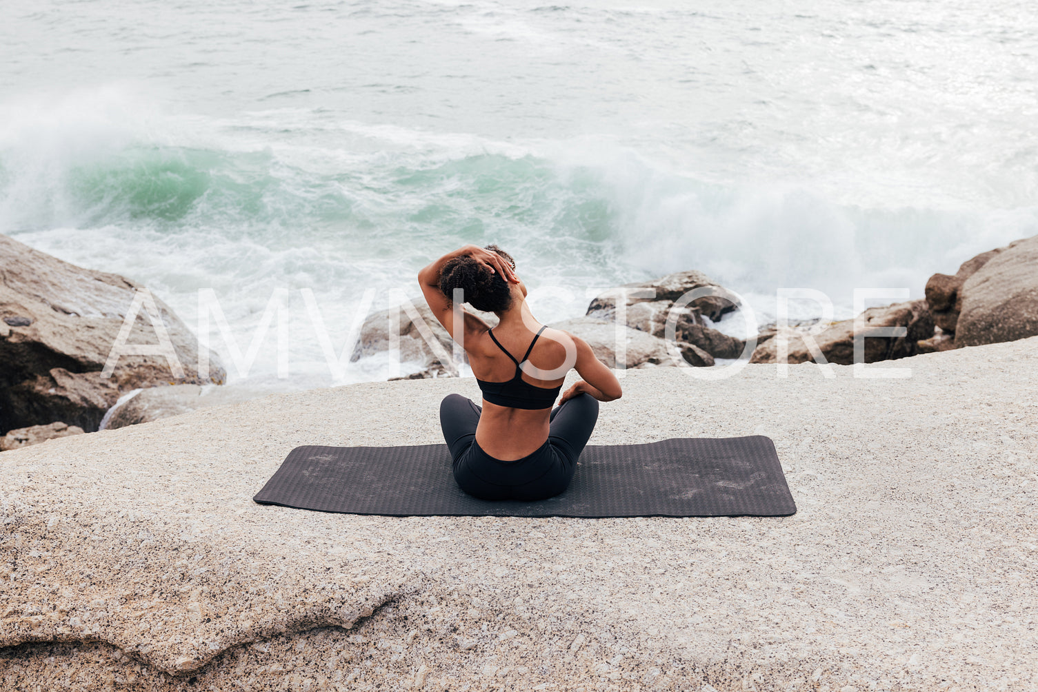 Slim woman in sportswear with yoga mat standing against beautiful