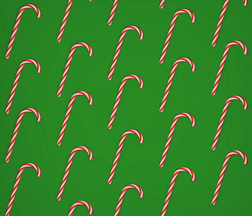 A lot of candy canes on a green background