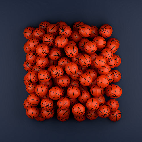 High angle of many basketballs on a blue background