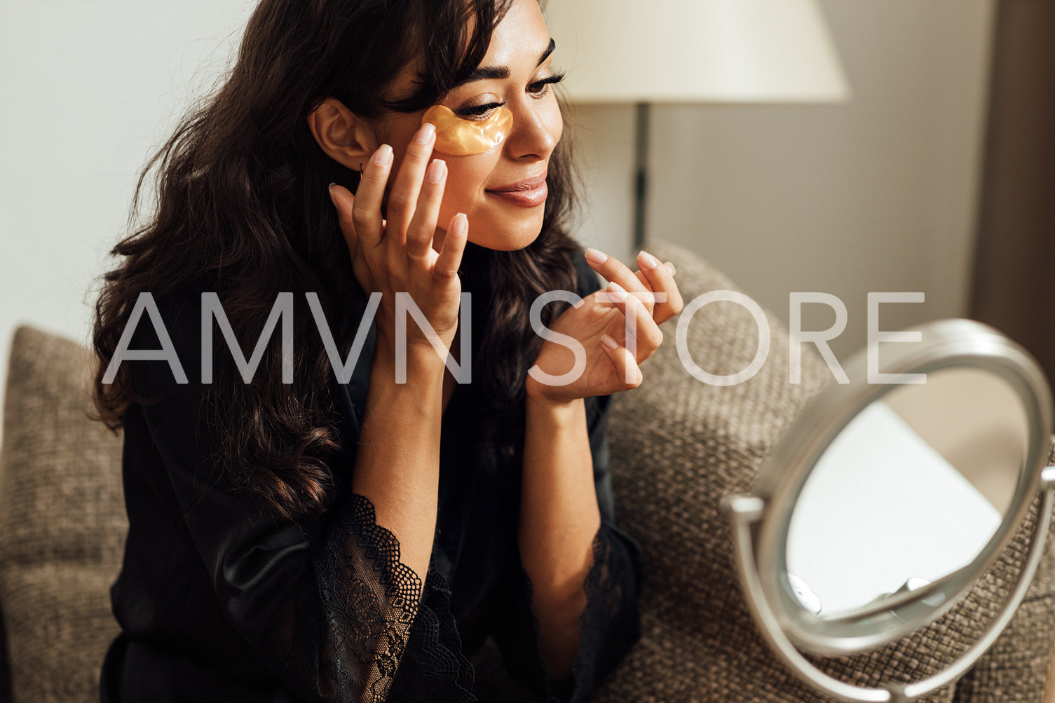 Young woman doing a skincare beauty routine at home in front of a mirror	