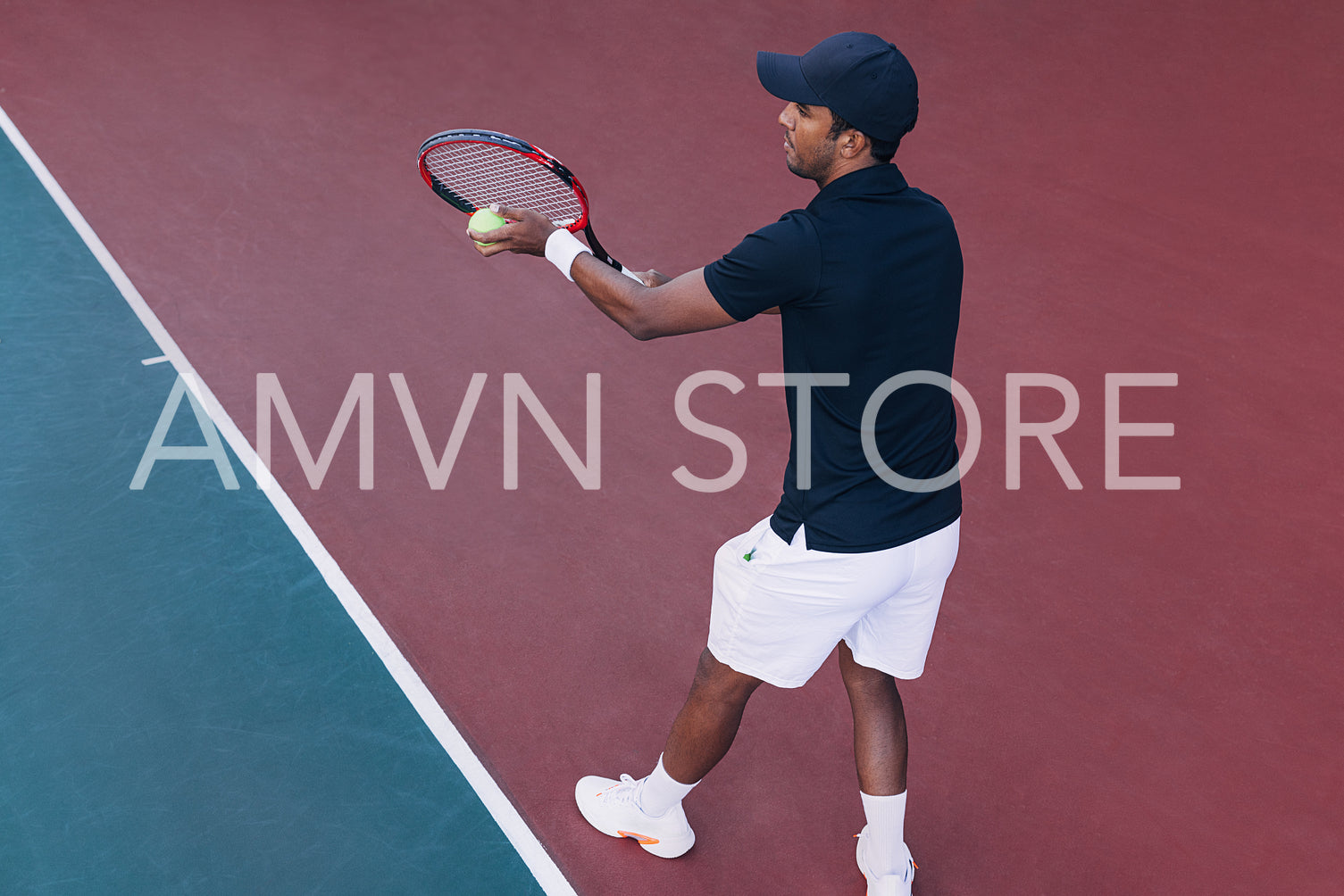 Young male tennis player ready to serve 