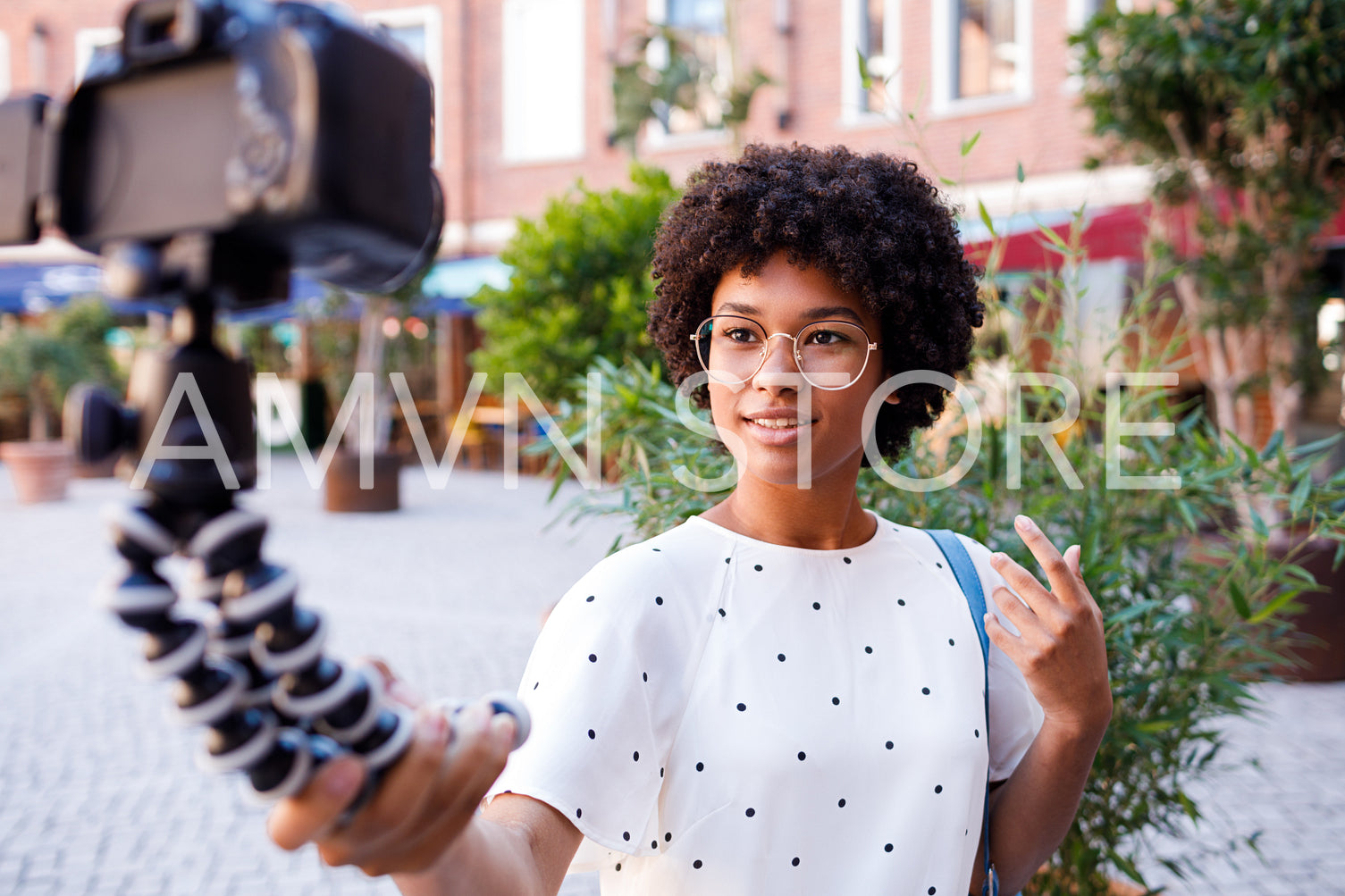 Female vlogger recording shooting video from her vacation	