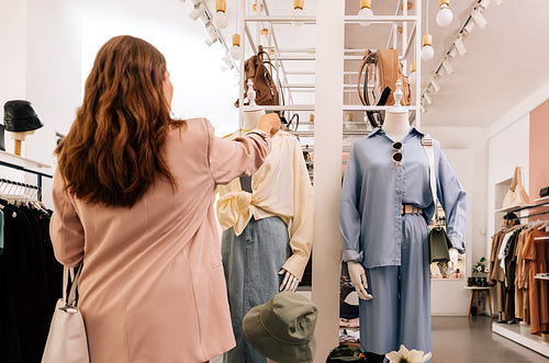 Woman standing in small boutique