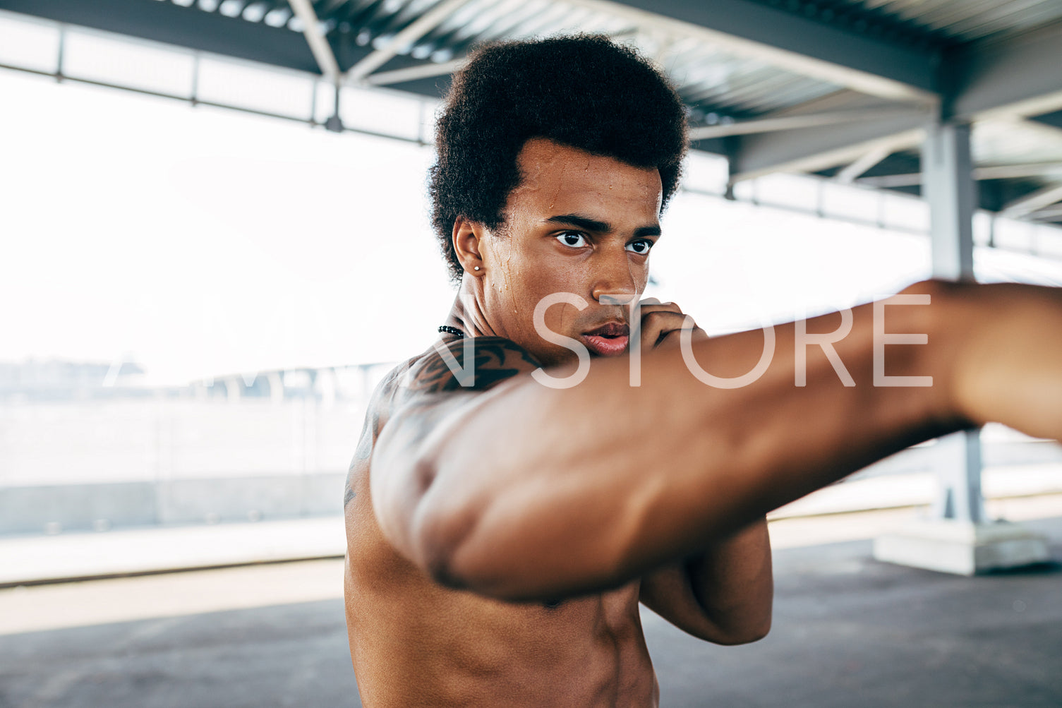 Close up shot of young kickboxer practicing punches	