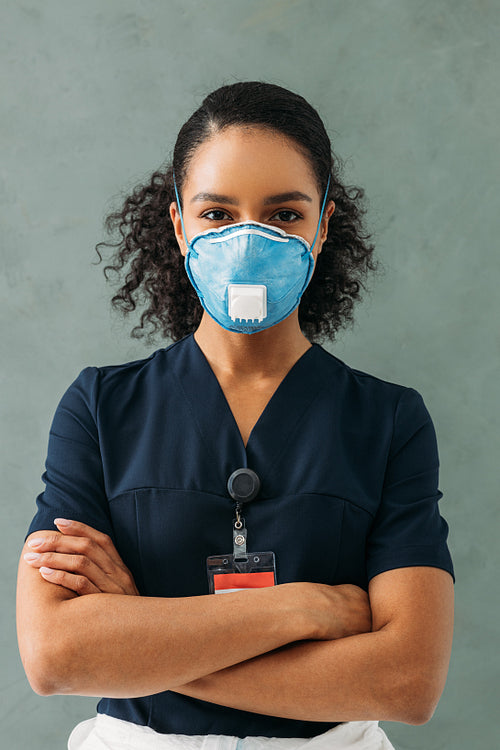 Portrait of a nurse wearing a medical uniform. Young confident doctor looking at camera.