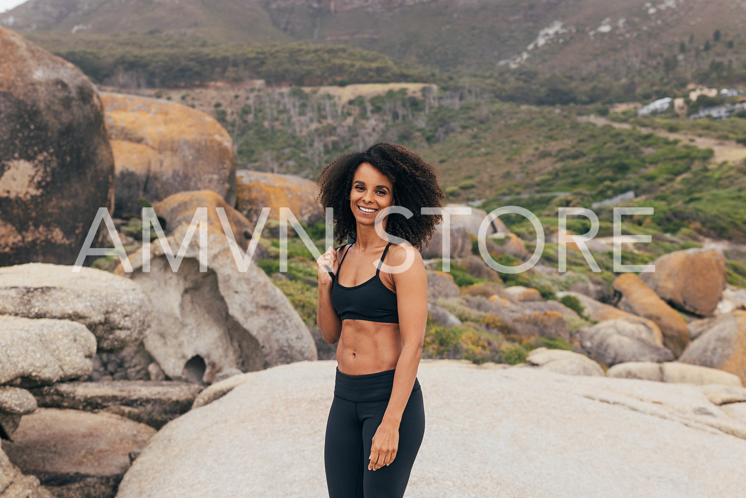 Beautiful woman with yoga mat standing outdoors. Smiling female 