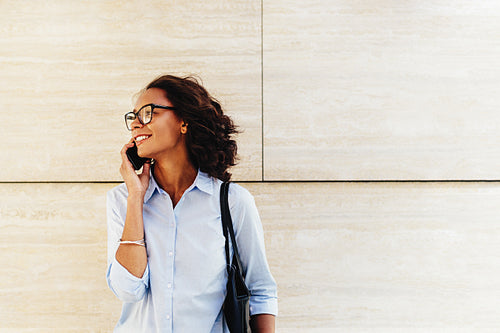 Beautiful businesswoman in formal clothes making a phone call