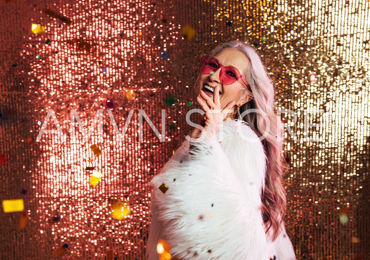 Happy senior woman with grey hair wearing white fur coat looking