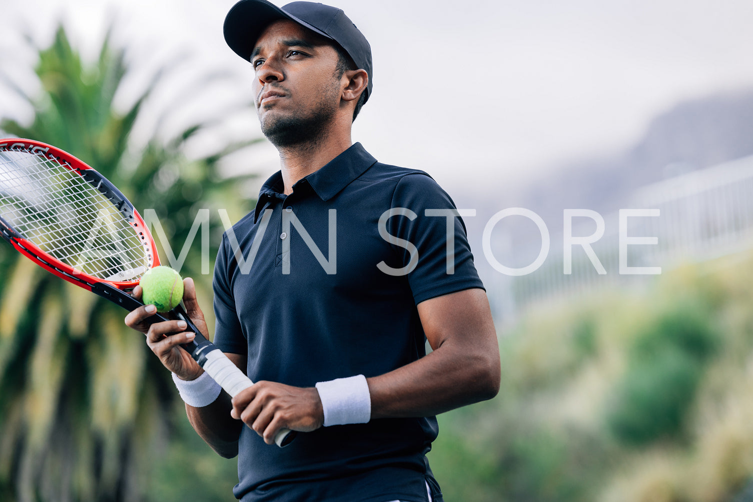 Young tennis player with racket and tennis ball