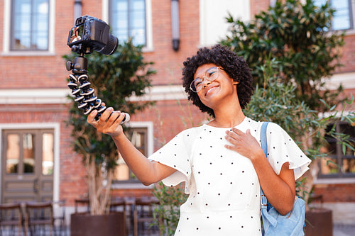 Girl vlogger recording content on a digital camera