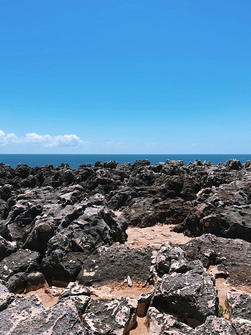 Many rocks on the coast near the ocean