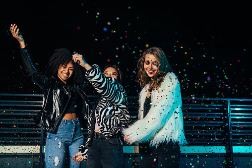 Laughing girls wearing stylish clothes