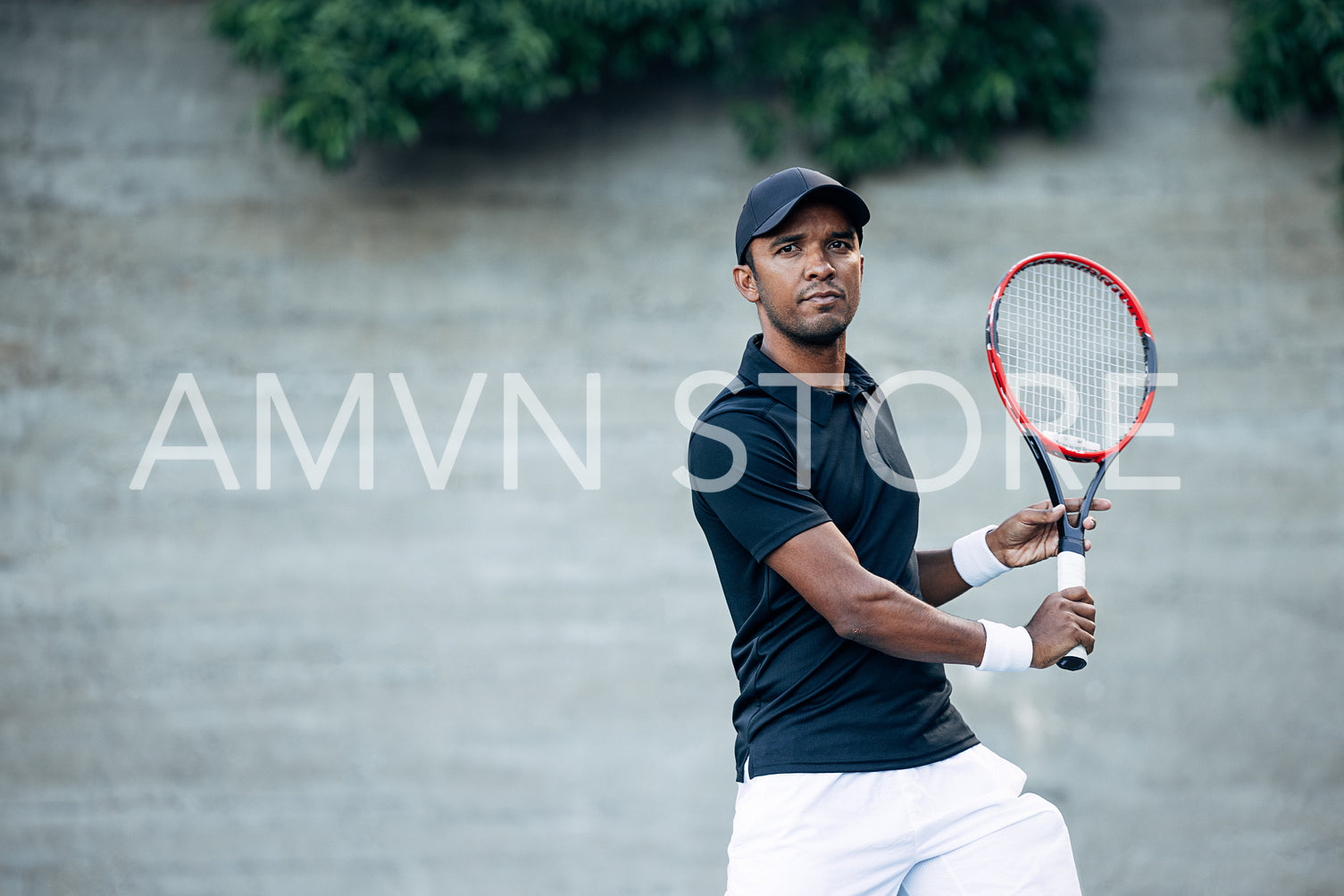 Male tennis player with racket during a match