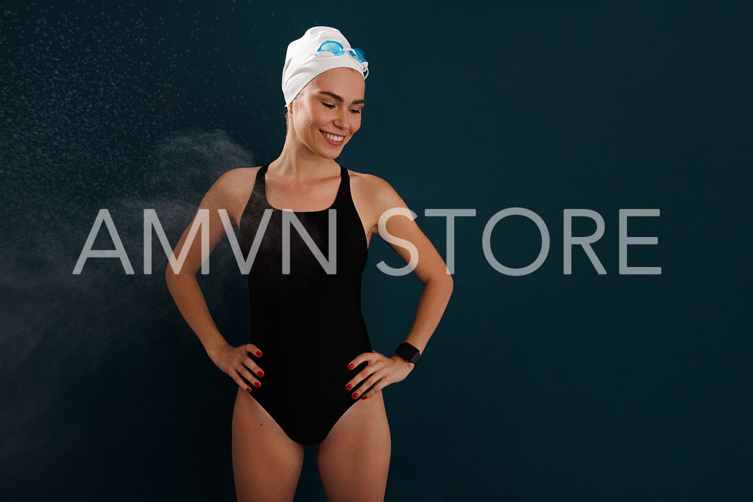 Young smiling woman swimmer in a swimsuit standing with closed eyes