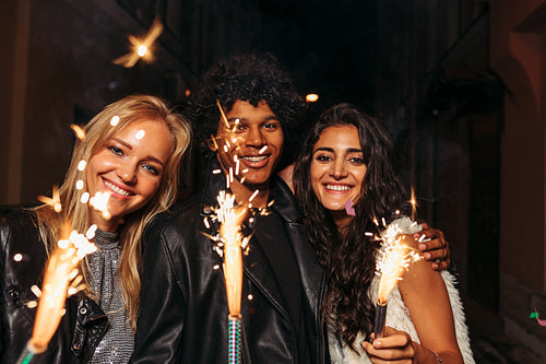 Young man and women enjoying new years eve outdoors