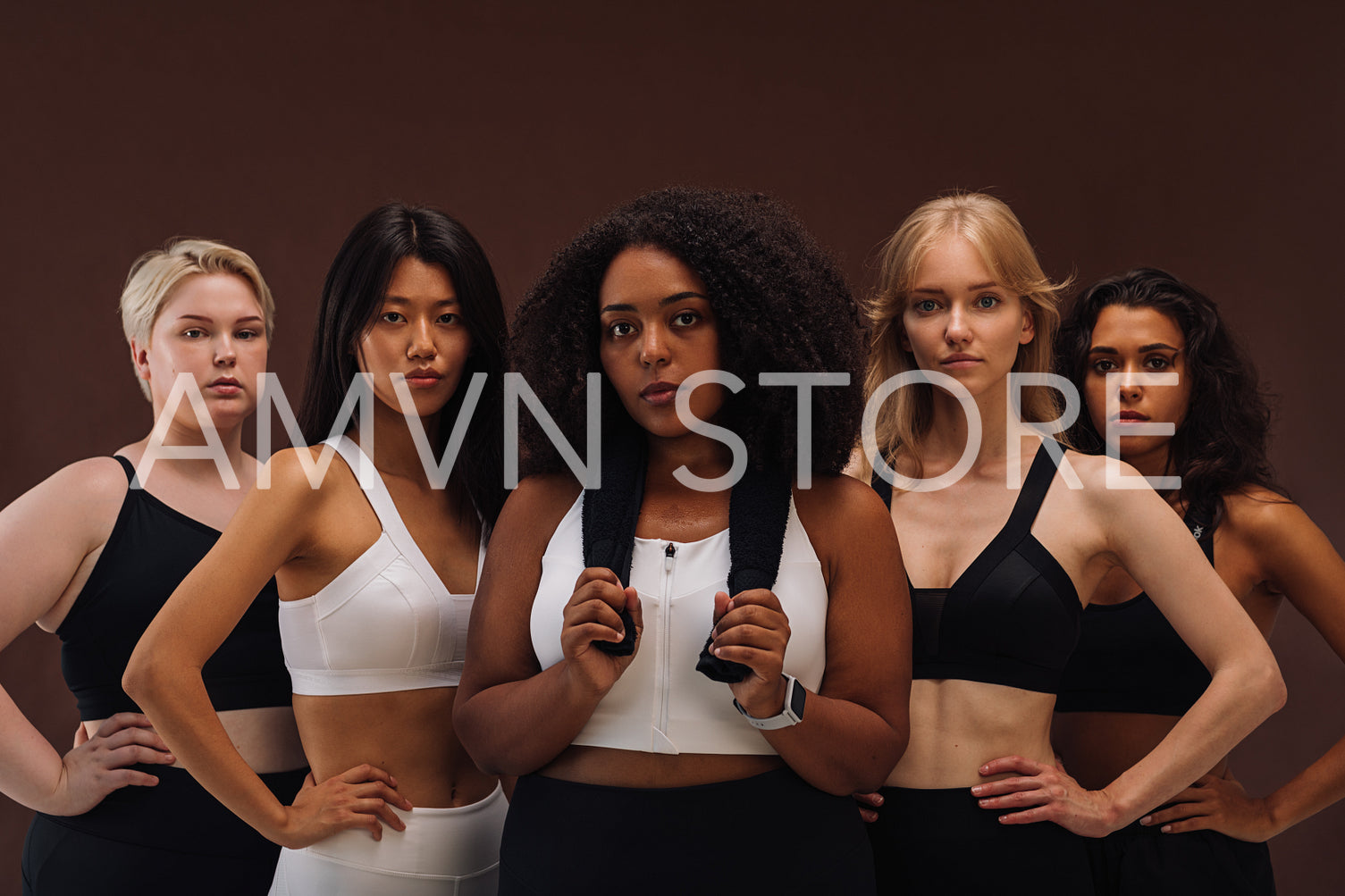 Diverse women in sportswear looking at the camera while standing