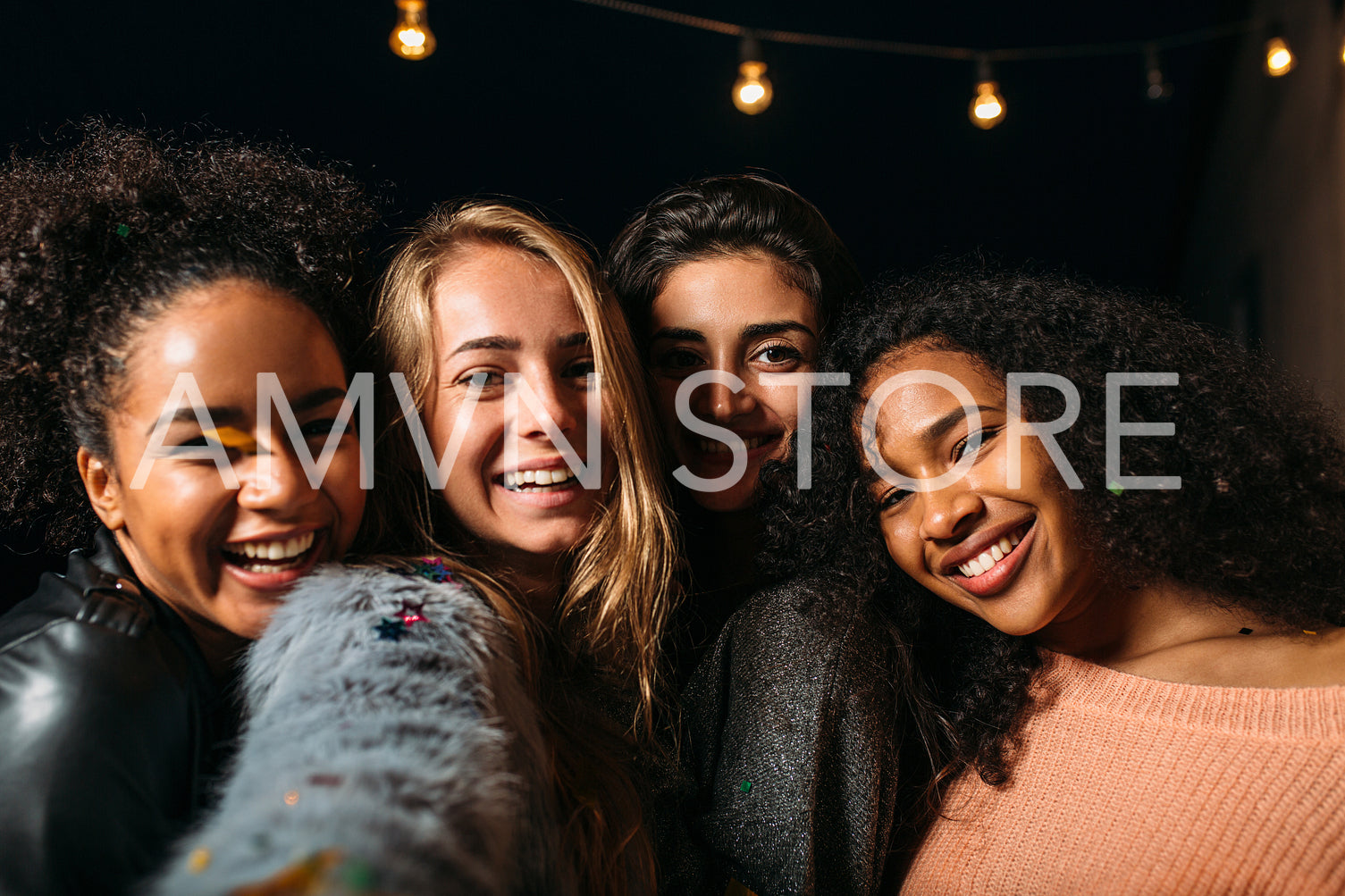 Portrait of four diverse women taking selfie and smiling