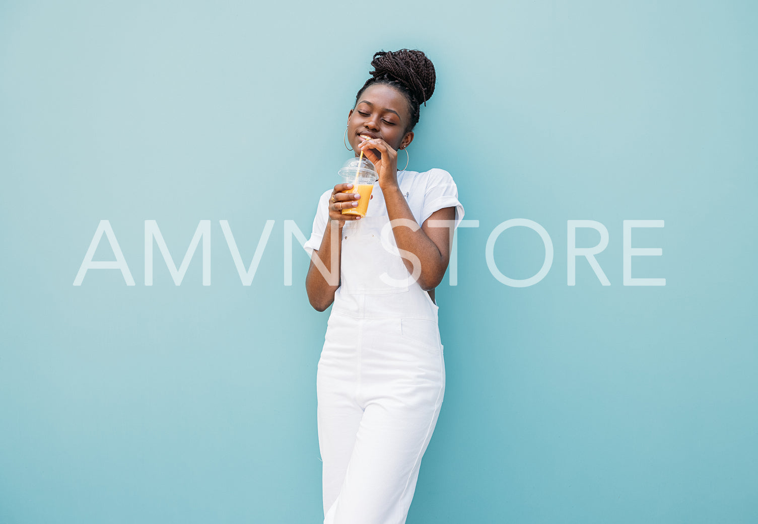 Young woman drinking orange juice