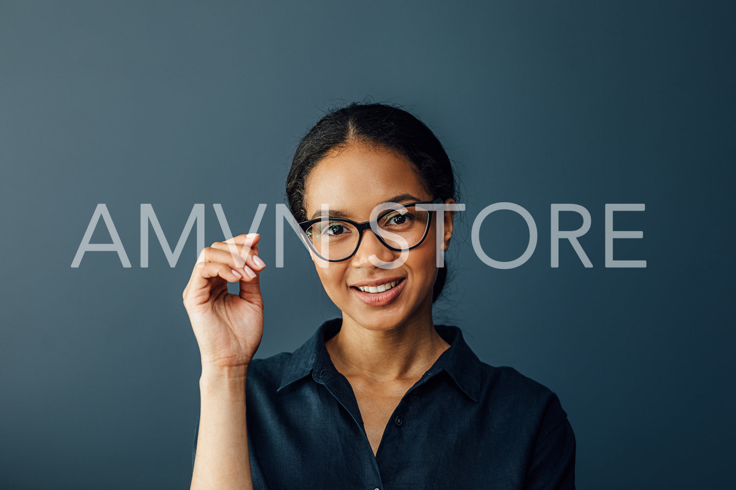 Close up portrait of a young businesswoman wearing spectacles and looking at camera	