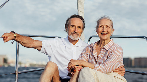 Senior couple enjoying quality time on sailing trip on a private yacht