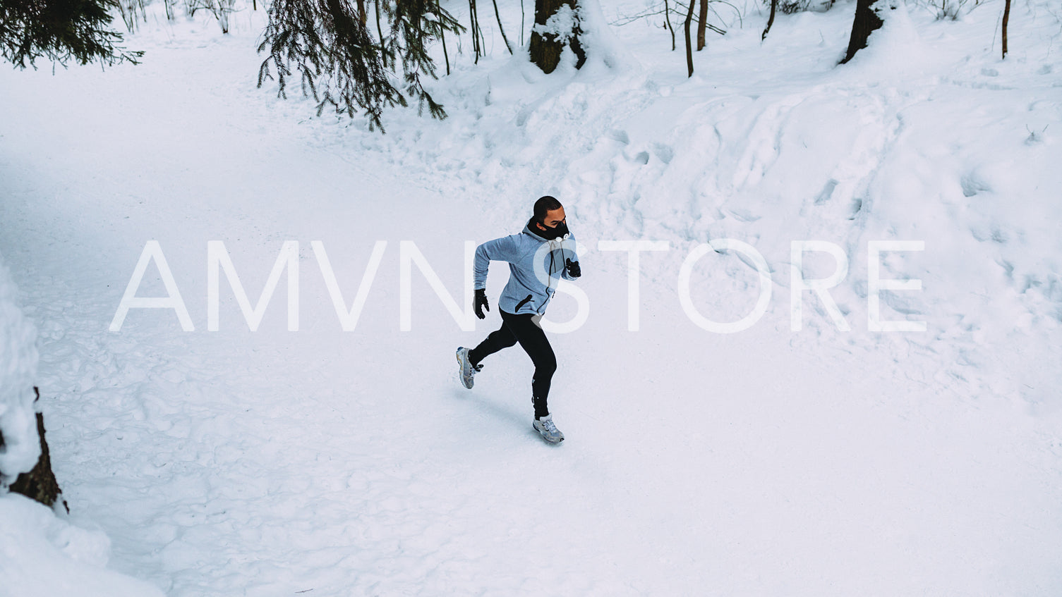 High angle view of runner in park with training mask on face.	
