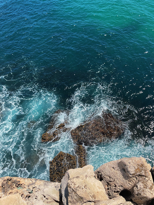 Shot from above on the ocean and rocks