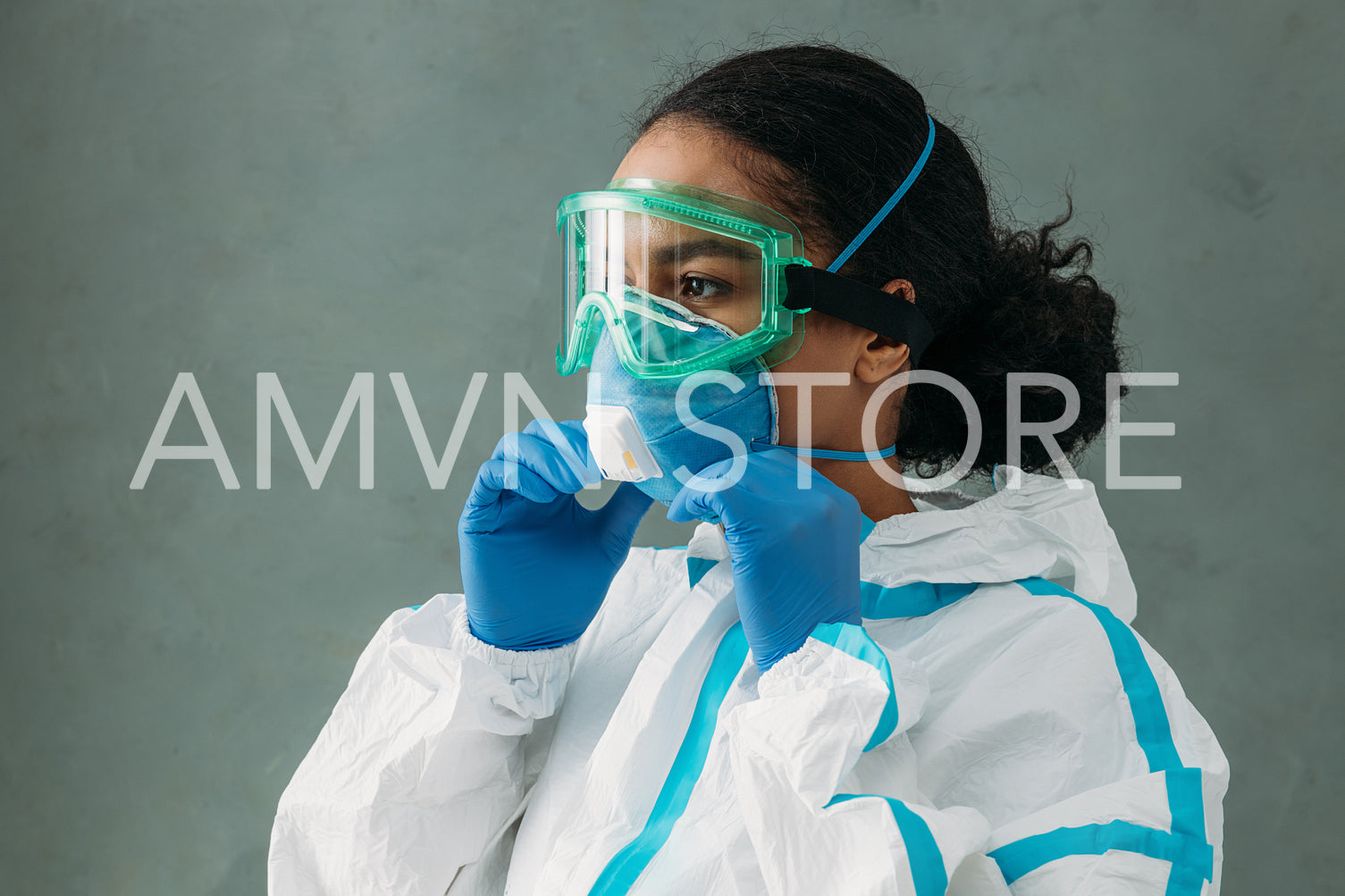 Young woman wearing a protective mask preparing for work	