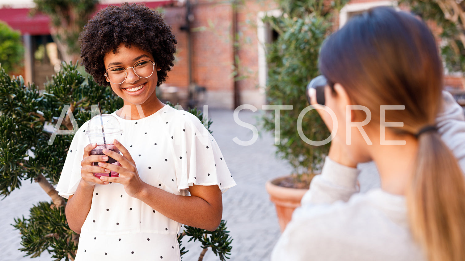 Personal photographer working with blogger, taking photos for social media	