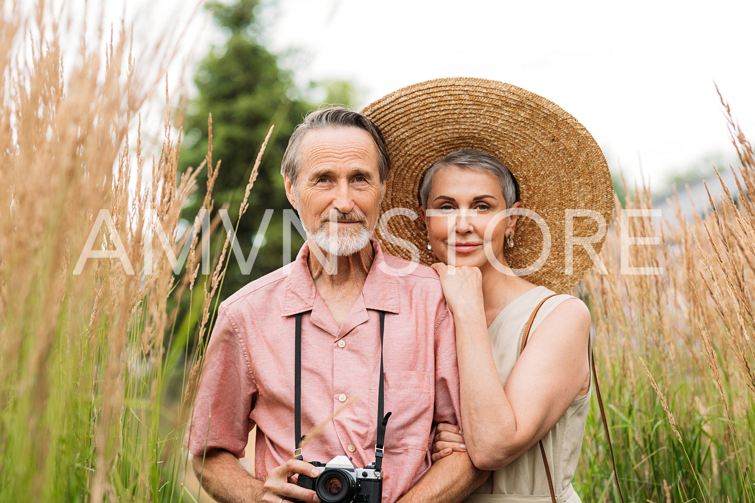 Portrait of a senior couple looking at camera while standing outdoors