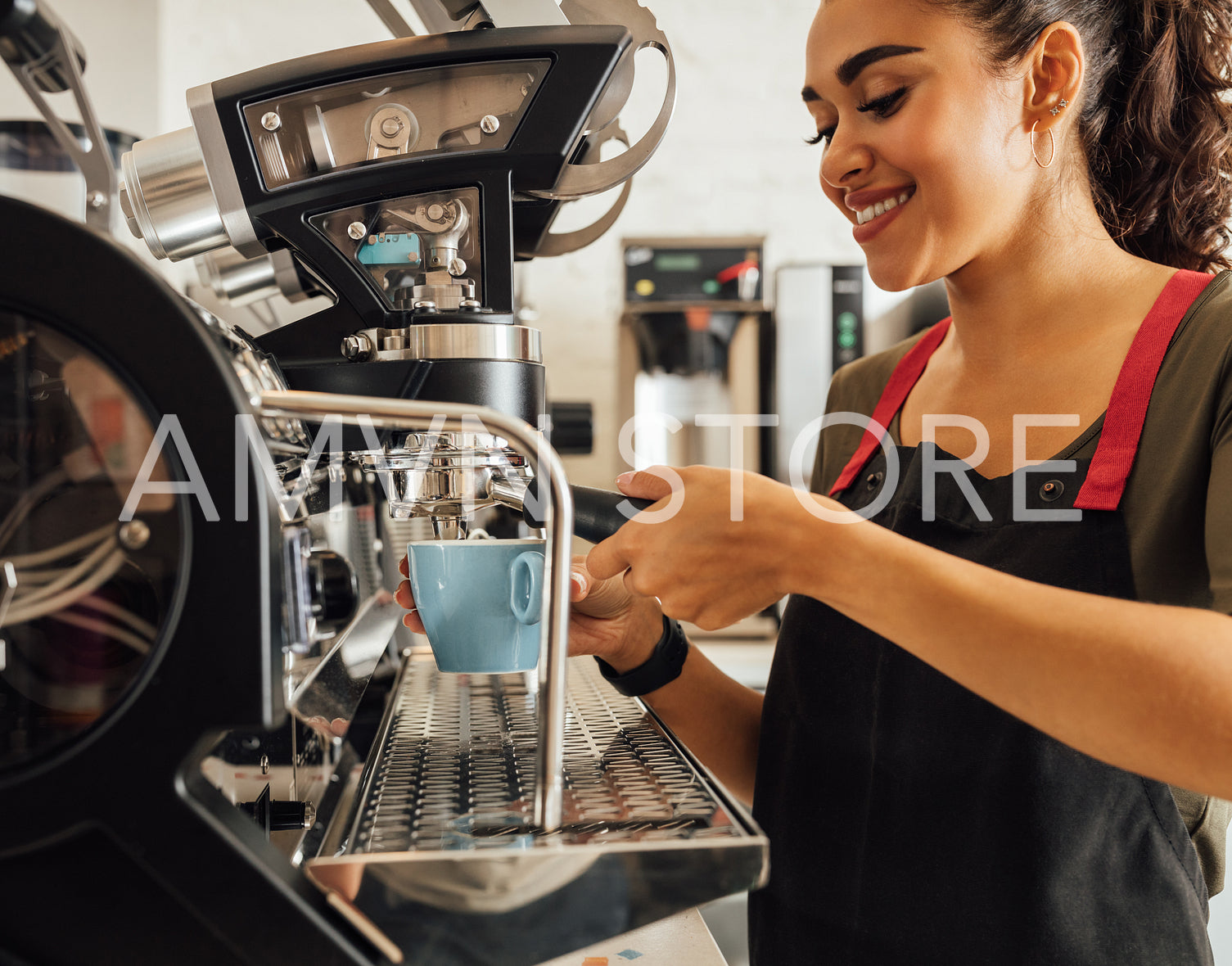 Smiling female barista using coffee maker in cafeteria. Woman in apron preparing espresso.	