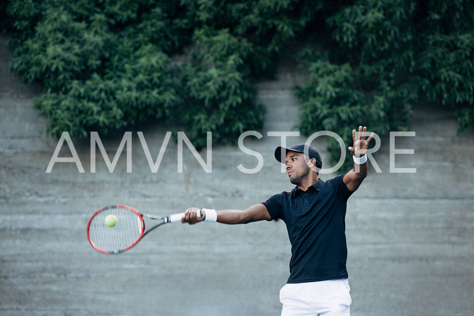 Professional tennis player hitting a ball with racket 