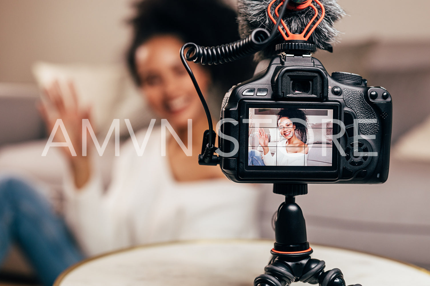 Vlogger recording content for her blog on a DSLR camera