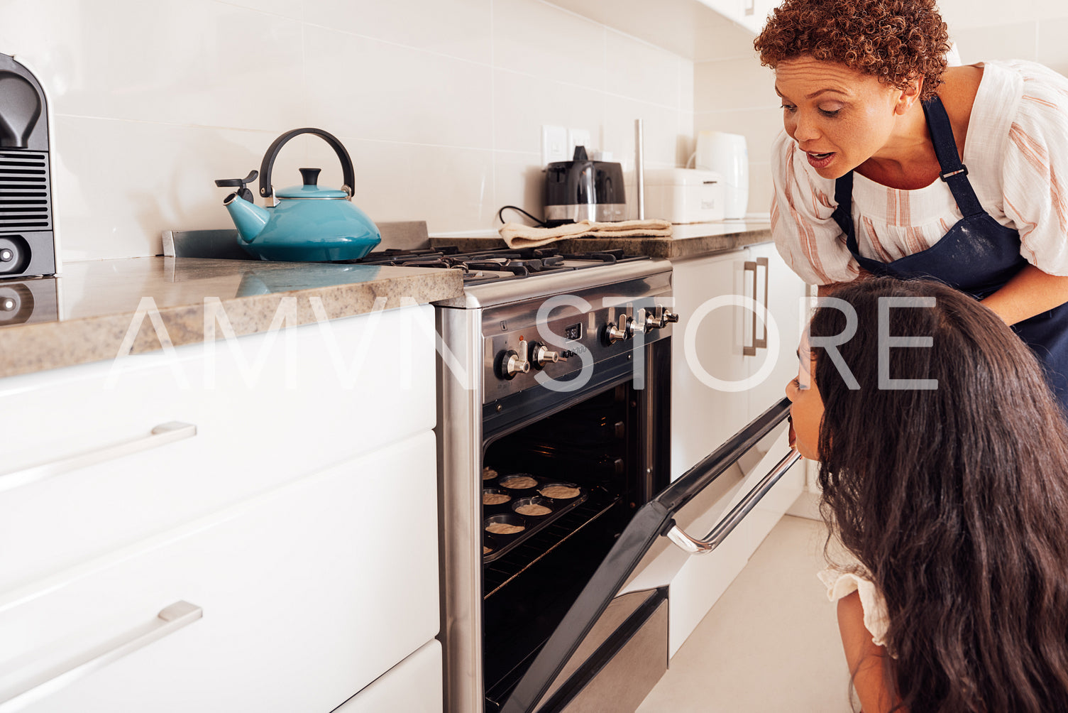 Girl and her granny opens the oven and looking inside