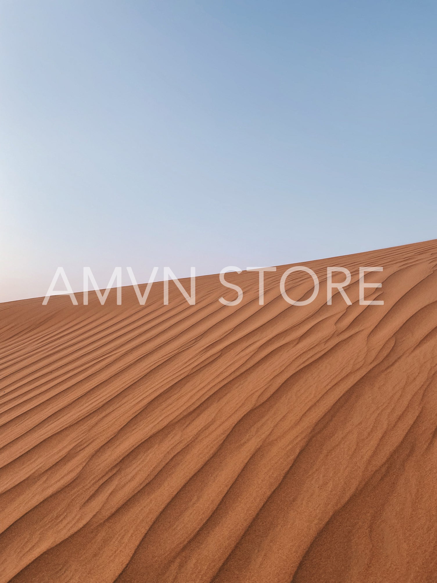 Minimalist shot of a dune against sky in desert