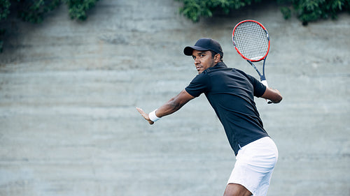 Confident male tennis player during a match