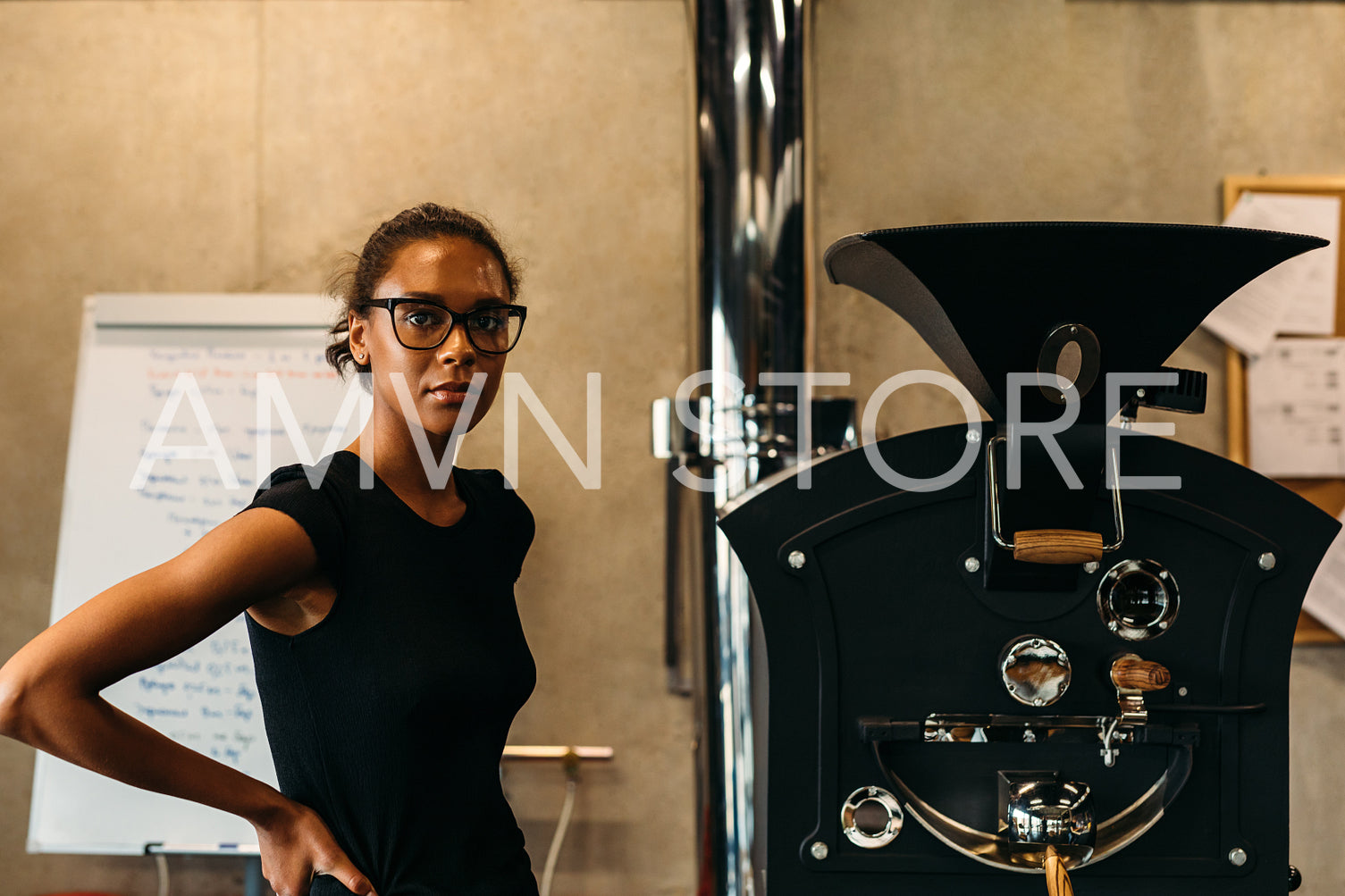 Portrait of a young entrepreneur in her coffee roastery	