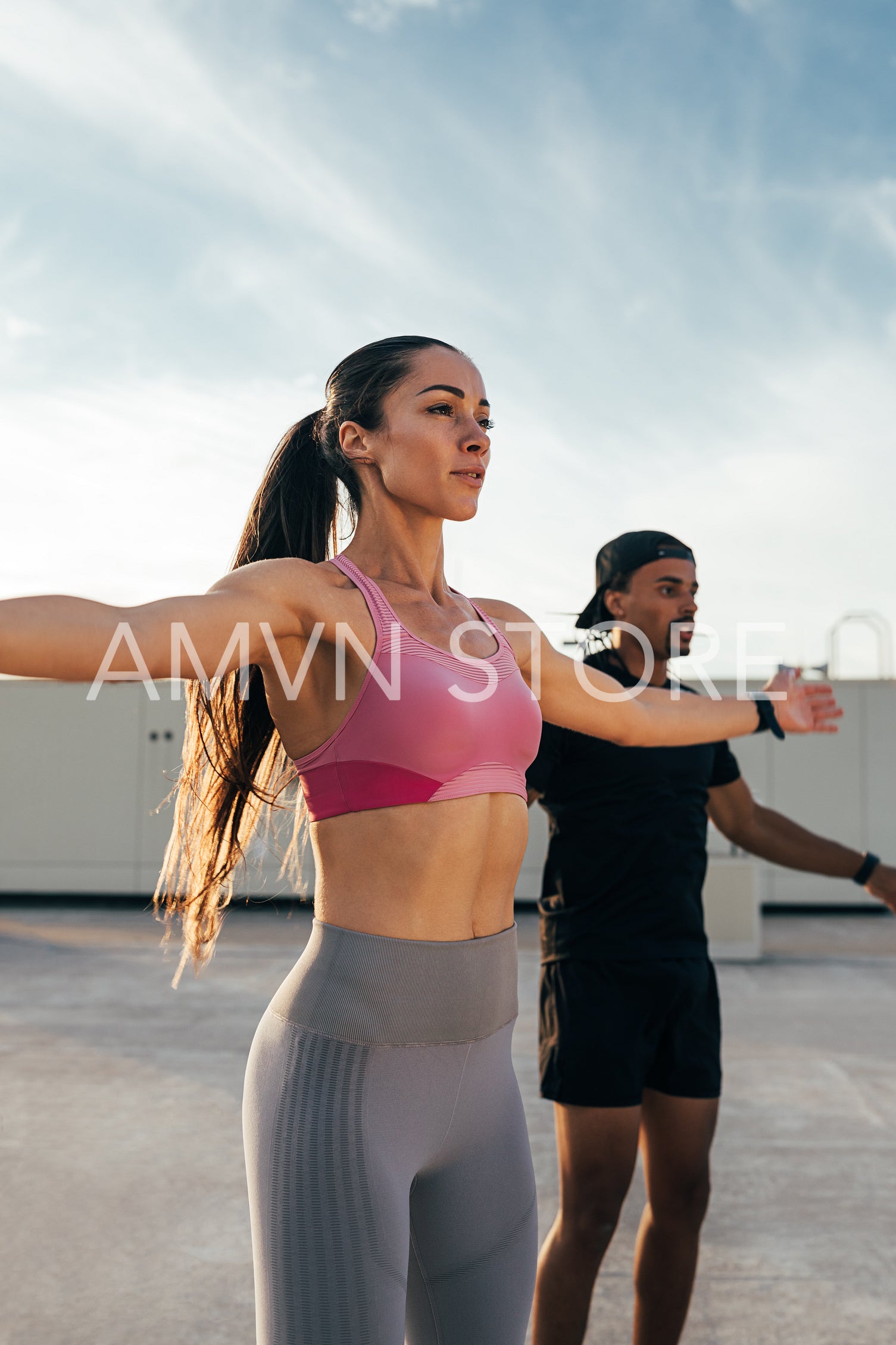 Two athletes doing cardio exercisese on rooftop