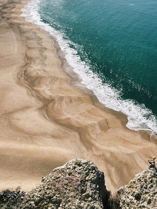 Long coastline with a beach on at sunny day