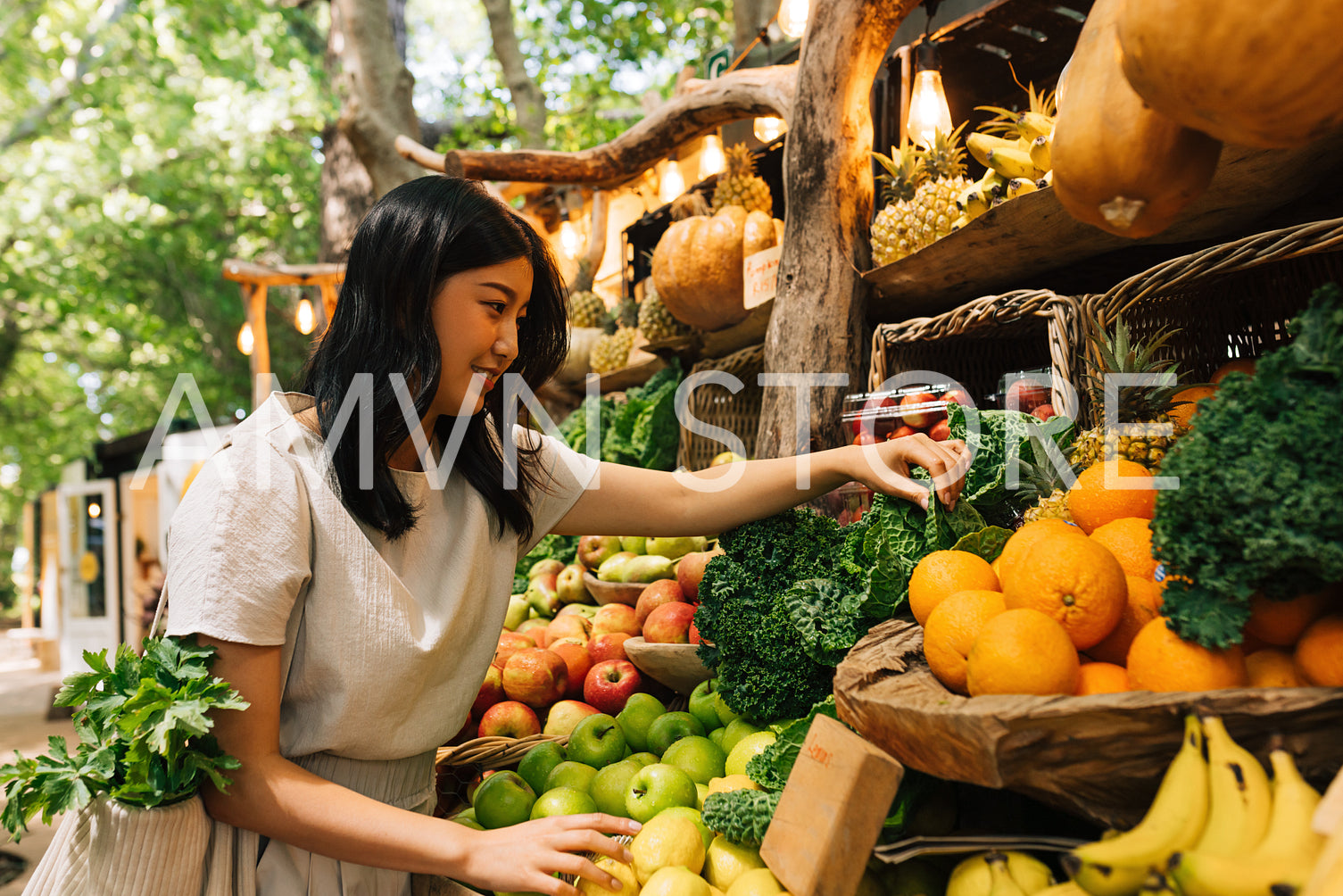 Asian woman choosing vegetables