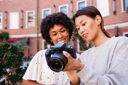 Photographer showing results of shoot to client