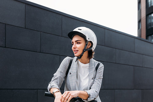 Portrait of young woman wearing safety driving helmet