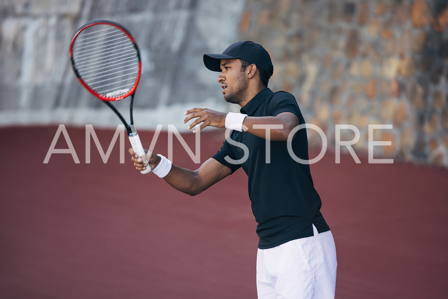 Tennis player in sportswear on an outdoors hard court