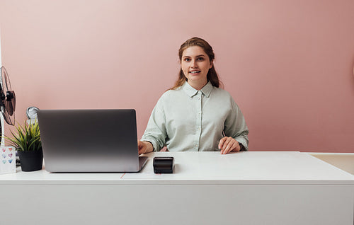 Portrait of a clothing store owner. Smiling woman working in her