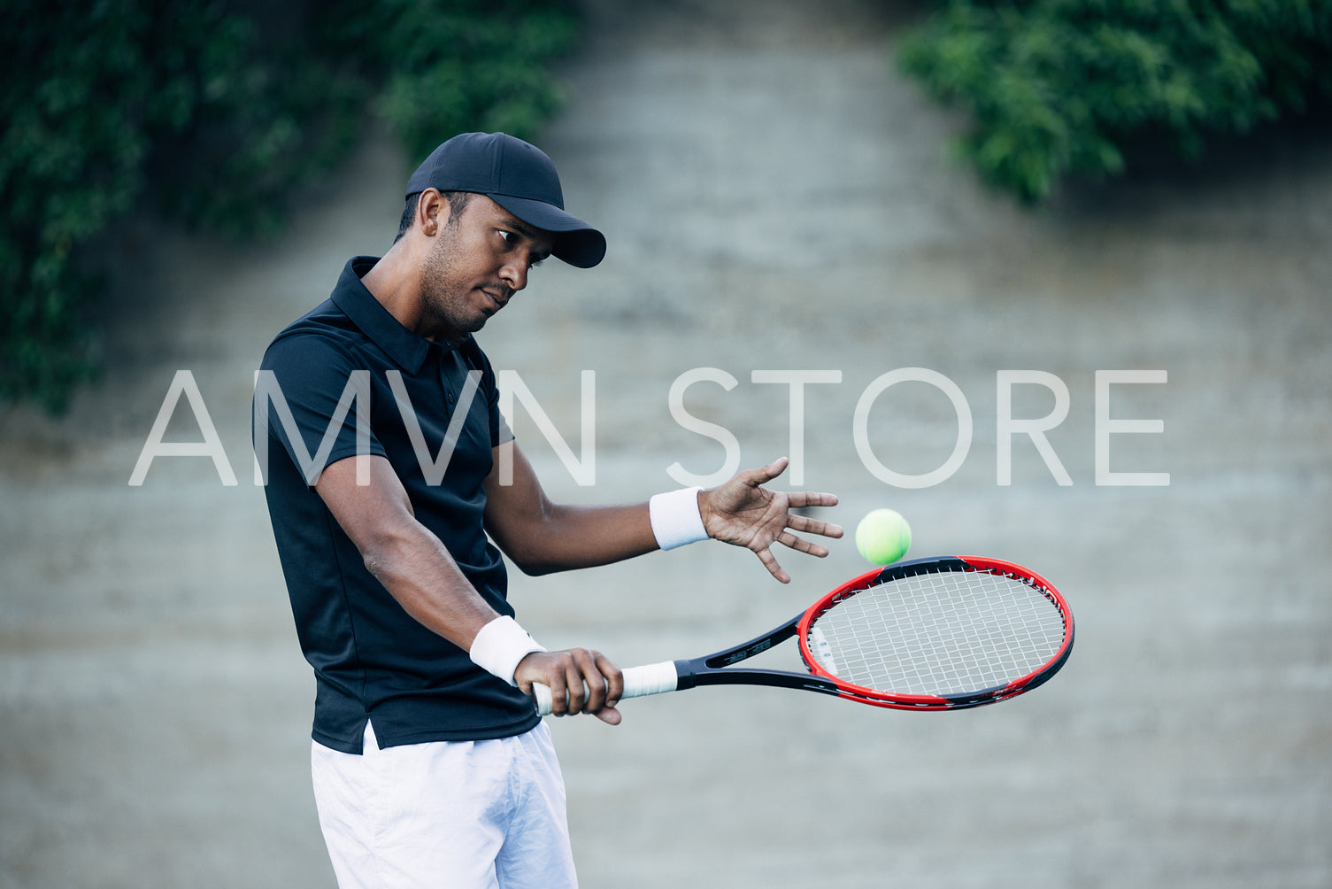 Tennis player returning the ball while practicing outdoors