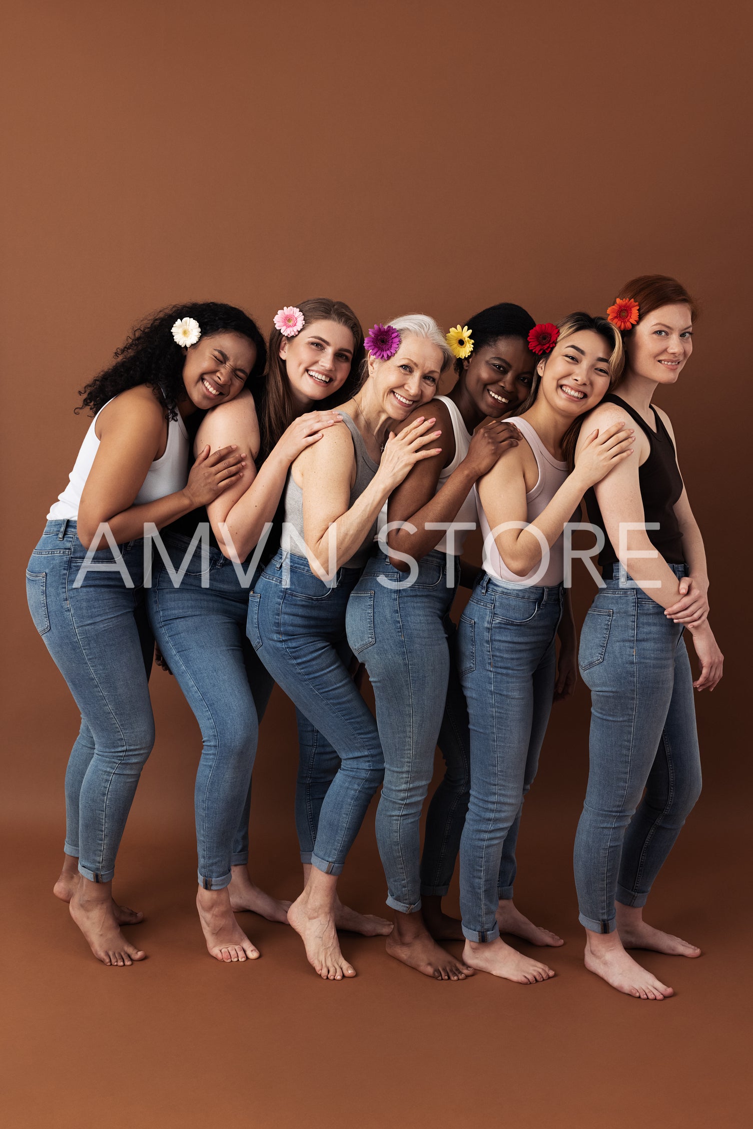 Full length of six women with flowers in their hair stands one after another against a brown background