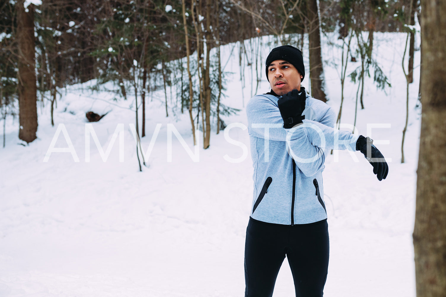 Sportsman warming up his hands. Young athlete in sport clothes preparing for run.	
