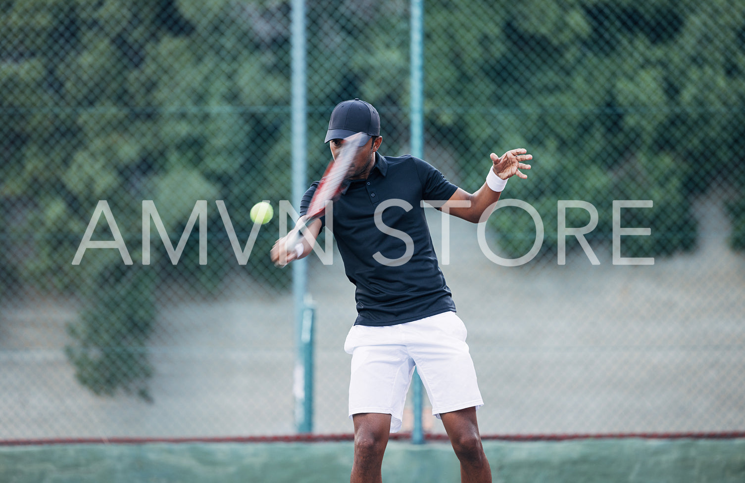 Professional tennis player hitting the ball outdoors