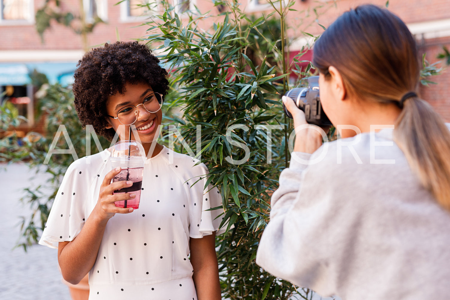 Photographer collaborating with a blogger. Two women creating content for social media.	