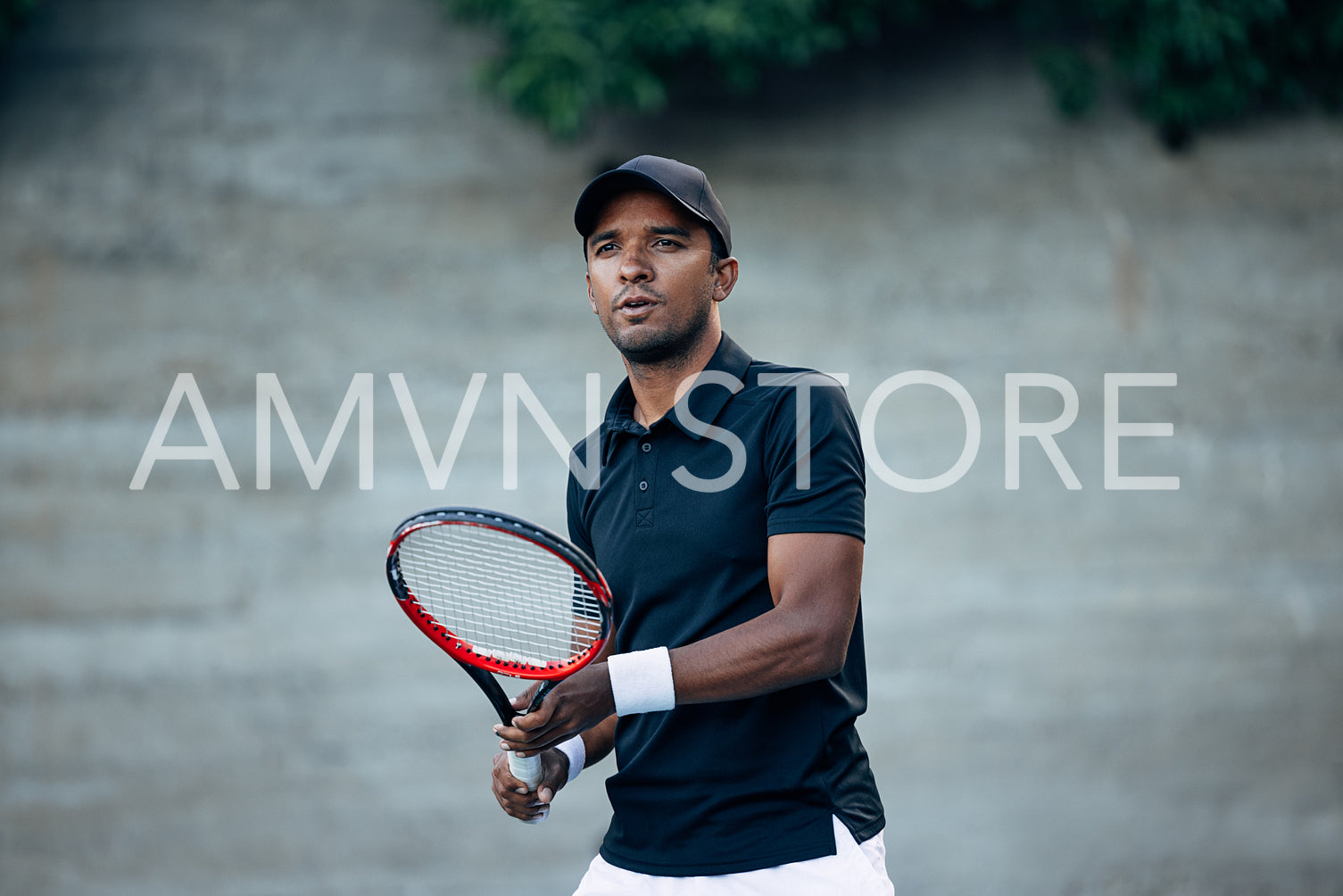 Tennis player looking after his serve