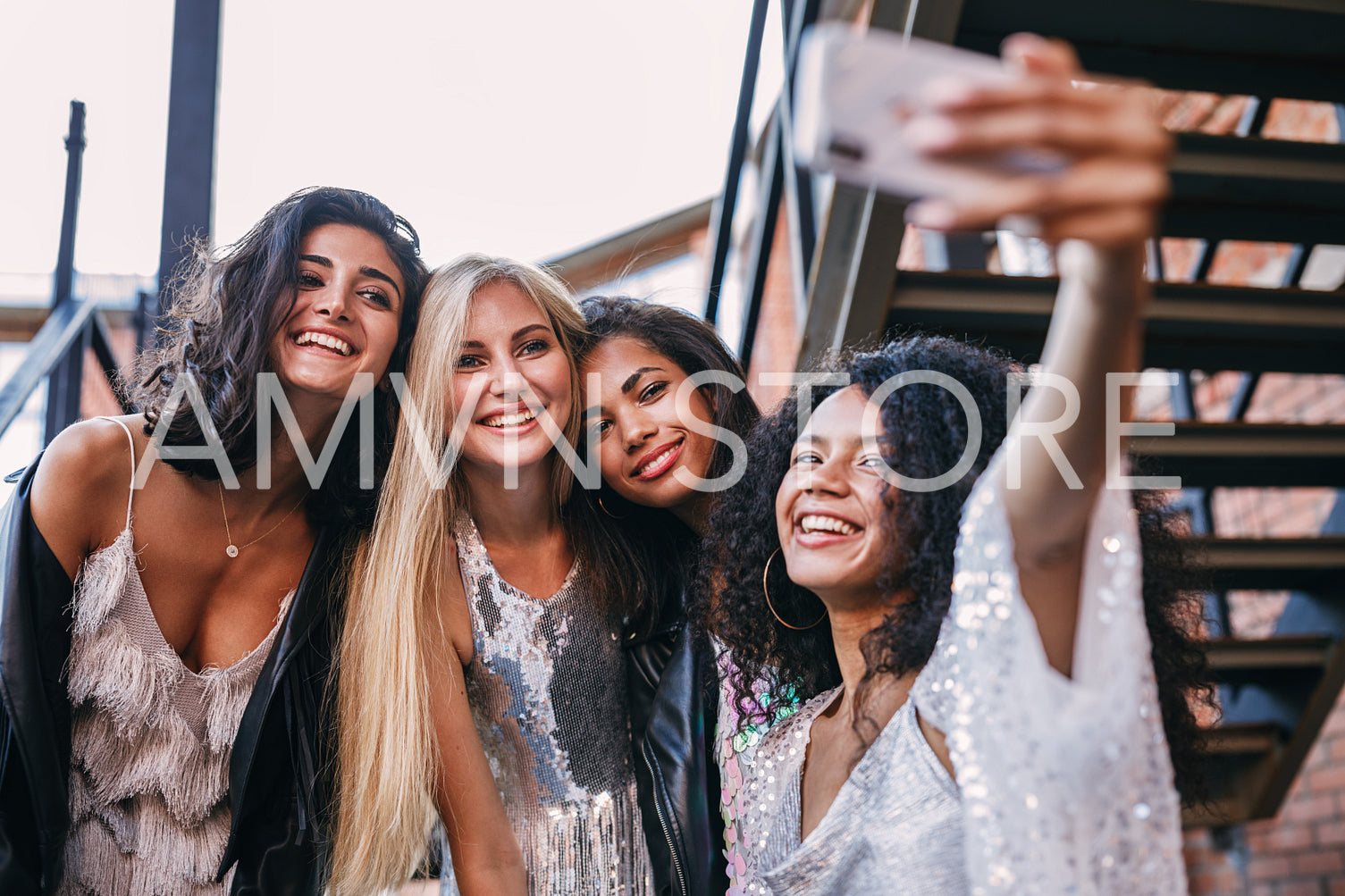 Happy friends taking a selfie. Women making a photo on cell phone.	